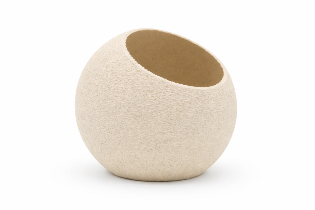 Macetero Coco redondo de diseño minimalista en color arena para plantas de interior