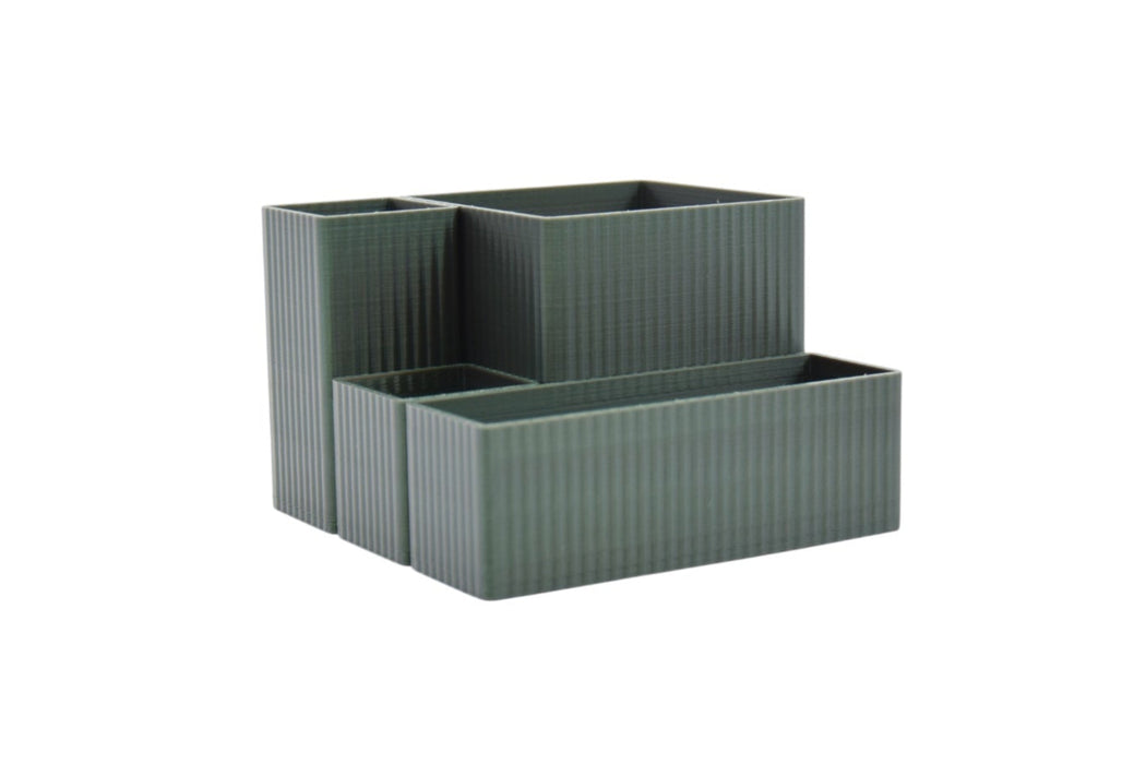 Vista lateral del organizador multifuncional verde fabricado en PLA sostenible