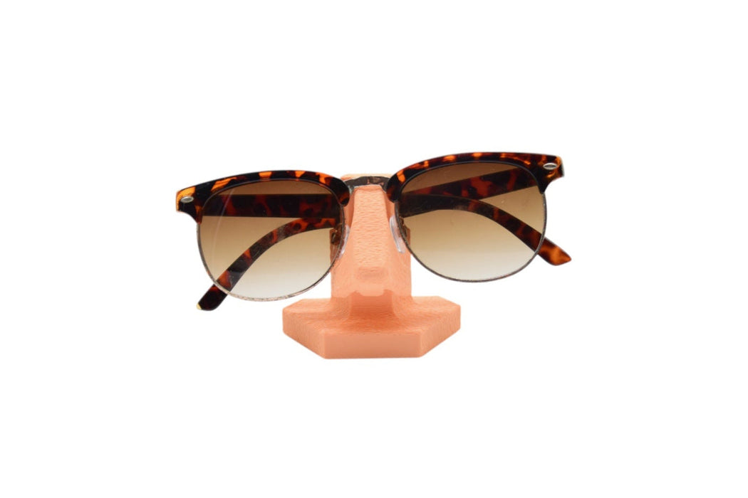 Soporte para gafas en forma de nariz con gafas colocadas