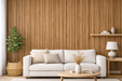 Vinilo decorativo efecto madera roble cálido aplicado en pared detrás de un sofá