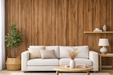 Vinilo decorativo efecto madera aplicado en pared de salón, detrás de un sofá